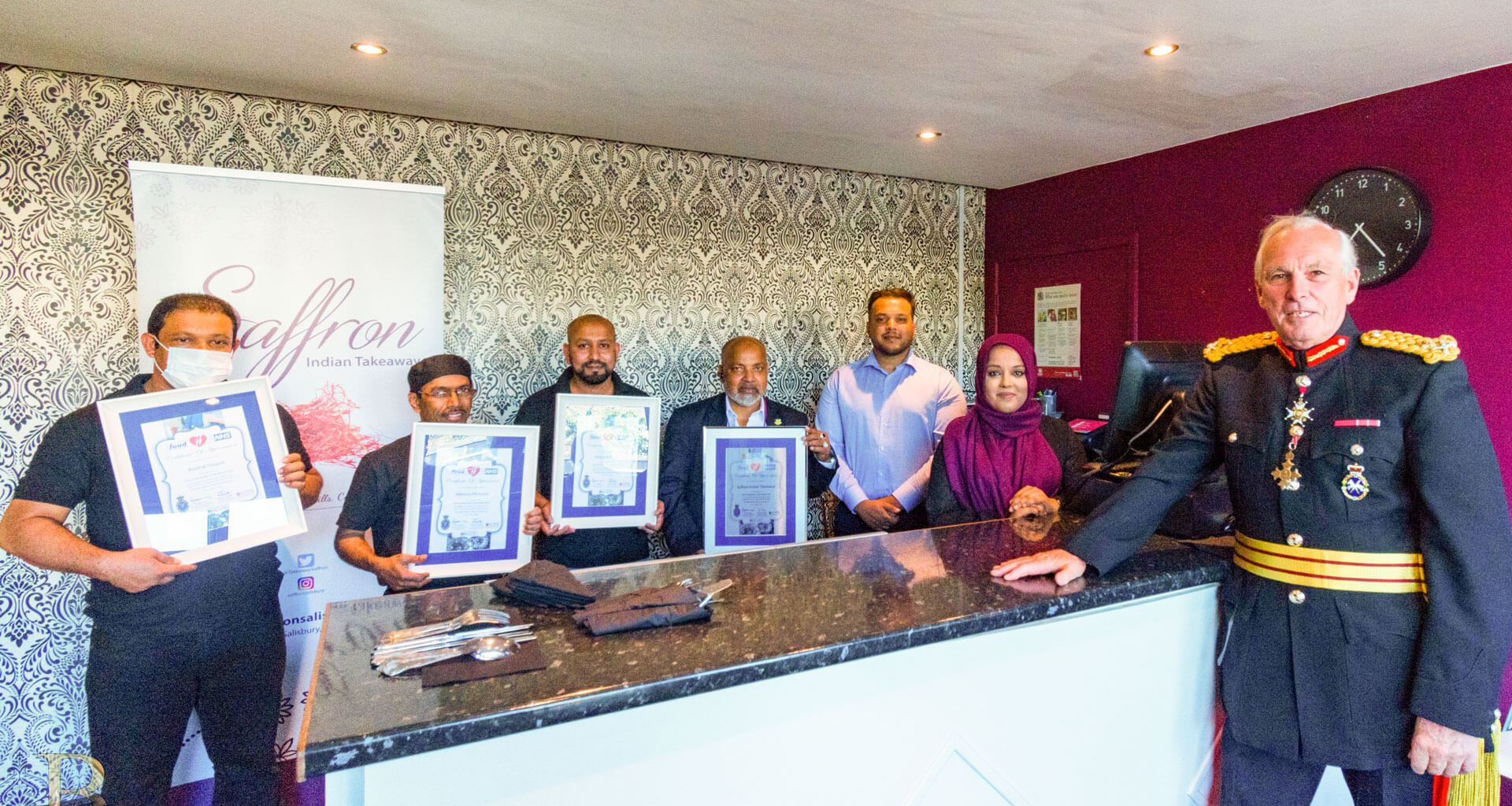 Group of people receiving an award.