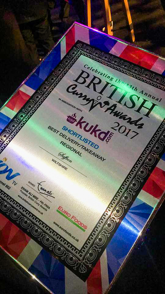 An award that is framed with the british flag.