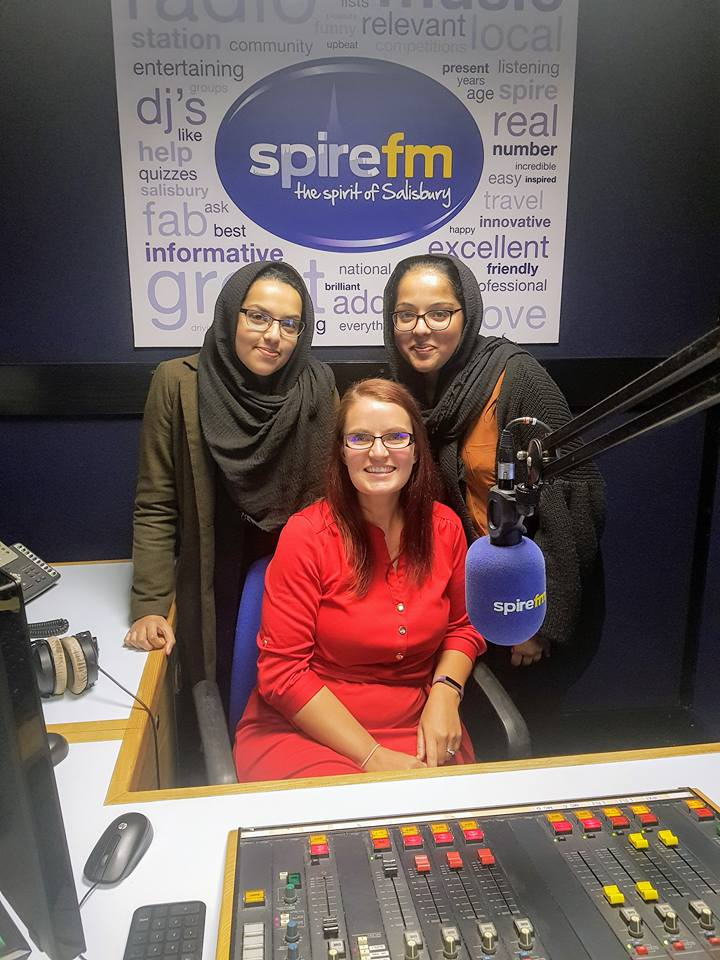 Three women inside a radio station